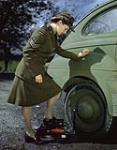 CWAC Sgt. Shirley McNeill and Foot Pump (Winter Dress) ca. 1943-1965.