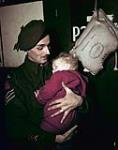Sgt. R.J. Israel and Infant Son ca. 1943-1965.