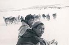 [Two Inuit men on dog sled] [between 1928 and 1944].