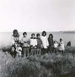 [Group of Inuit children by shore] [between 1928 and 1944].
