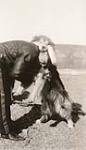 [Inspector Henry Larsen with dog] 1914-1961