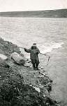 Spearing fish near Cambridge Bay. (George Grover) [between 1934 and 1939].