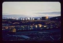 View of a construction site with oil tanks in the background, Iqaluit, Nunavut [between June 17-August 24, 1960]