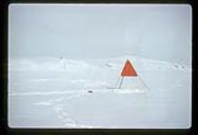 Orange marker in a snowy landscape [between June 17-October 31, 1960]