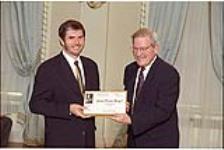 [Jean-Pierre Rogel, science reporter for Radio Canada receives 1998 Michener-Deacon Fellowship from Chief Justice Antonio Lamer] April 28, 1998.