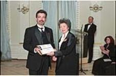 [Metro editor Marty Beneteau accepts a 1999 Michener Citation of Merit award from Governor General Adrienne Clarkson on behalf of the Windsor Star] April 10, 2000.