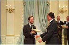 [François Brousseau accepts the 1994 Michener-Deacon Fellowship from Governor General Ramon Hnatyshyn] May 9, 1994.