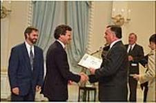 [Greg Weston, representing the Ottawa Citizen. accepts the 1993 Michener Award from Governor General Ramon Hnatyshyn] May 9, 1994.