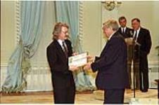 [Murdoch Davis, editor-in-chief, accepts the Citation of Merit from Governor General Roméo LeBlanc on behalf of the Journal] May 12, 1995.