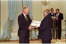 [Dave Ellis, Assistant Managing Editor, accepts the Michener Citation of Merit from Governor General Roméo LeBlanc on behalf of The Star] May 12, 1995.