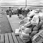 [Unloading bags of sugar, Iqaluit, Nunavut] 1960