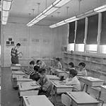 [Students working at their desks, Iqaluit, Nunavut] 1960