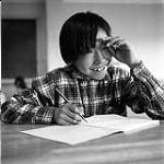 [Boy writing in a workbook, Iqaluit, Nunavut] 1960