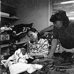 [Two women sewing at the Rehabilitation Centre in Niaqunngut, Iqaluit, Nunavut] 1960
