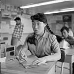 [Girl sitting at a desk in a classroom, Iqaluit, Nunavut] 1960