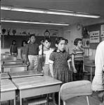 [Children standing in a classroom, Iqaluit, Nunavut] 1960