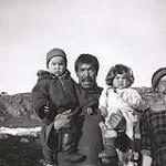 [Shenangnak carrying two children, Killiniq, Nunavut] 1960