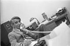 Unidentified man speaking on telephone [between 1900-1993]