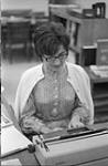 Unidentified woman typing [between 1900-1993]