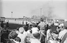 Crowd watching arrival of steam train [between 1900-1993]