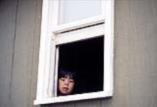 Young girl in window, Repulse Bay 1979.