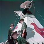 Tepee, brought to Canada's first Scout Jamboree by Saskatchewan Scouts, is assembled by the World Patrol at Connaught Ranges, Ottawa juillet 1949
