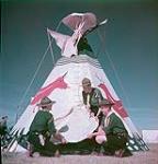 Tepee, brought to Canada's first Scout Jamboree by Saskatchewan Scouts, is assembled by the World Patrol at Connaught Ranges, Ottawa juillet 1949