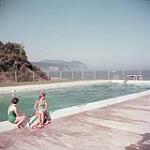 Two women sitting on the edge of an outdoor pool, Fundy National Park, New Brunswick 1952