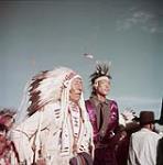 Indians of the Blood Indian tribe costumed for their annual Sun Dance ceremony at the Blood Indian Reserve near Cardston, Alberta. août 1953
