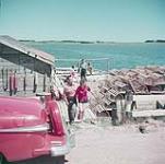 Fishing wharf at Rustico, Prince Edward Island National Park, P.E.I. [Quai de pêche à Rustico, parc national de l'île du Prince Edouard.] juillet 1953.