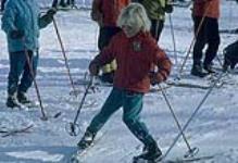 Young skier snowplowing. Midget Skiing (probably Camp Fortune) février 1964