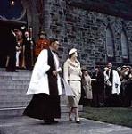 Her Majesty Queen Elizabeth II walking with the Dean of Christ Church Cathedral during her royal tour, Ottawa October 13, 1957.