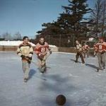 Game of broomball on an outdoor ice rink, Ottawa [between 1955-1963]