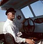 Charles Morency at the wheel of his boat, the "Provancher", Île aux Basques, Quebec   [entre 1955-1963]