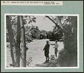 Casting for trout in the fast waters of the Petawawa River, Algonquin Park, Ont. [Entre 1930 et 1960].