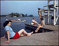 Early summer swimming in the St. Lawrene River near Brockville, Ontario.  1949.