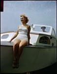 Betty Jackson, 16, aboard sailboat at Sarnia, Ontario Yacht Club. [Betty Jackson, 16, à bord un bateau à voile au club de Yacht de Sarnia, Ontario.] 1949.