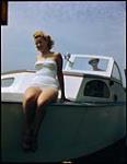 Betty Jackson, 16, aboard sailboat at Sarnia, Ontario Yacht Club. [Betty Jackson, 16, à bord un bateau à voile au club de Yacht de Sarnia, Ontario.] 1949.