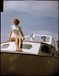 Betty Jackson, 16, aboard sailboat at Sarnia, Ontario Yacht Club. 1949.