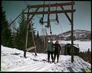 Members of McGill Ski School on T-Bar lift at Chantecler, Ste. Adele in the Quebec Laurentians. janvier 1952.