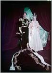 H.M. Queen Elizabeth II and HRH the Duke of Edinburgh in Throne Room of Buckingham Palace. [1950].