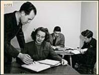 Corporal Marie Ballard with teacher M. L. Trusler at Tutorial School in Toronto April 1943
