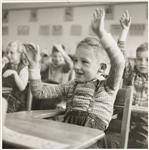 [Grade two students seated at desks with hands raised] 1953