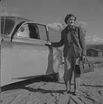 [Public Health Nurse Joyce Driver by her car] September 1953