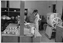 Two Aboriginal women working at the old Nursing Station, Aklavik, NWT 1975