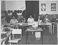 Group of men seated at desks at the Community Development Semniar, 1963-64, Saskatchewan [entre 1963-1964]