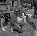 Woman Kneeling at Children's Zoo, Stanley Park, Vancouver, British Columbia [ca1954-1963]