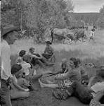 Group of Trail Riders Sitting, Williams Lake, British Columbia [ca1954-1963]