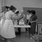 Group of Nurses Looking at Organs [ca.1954-1963]