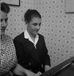 Two women playing piano  [ca1954-1963]